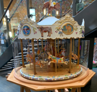 A small carousel with attention to detail and many types of animals. Found in a building on Monroe ave between Pearl street and Louis street