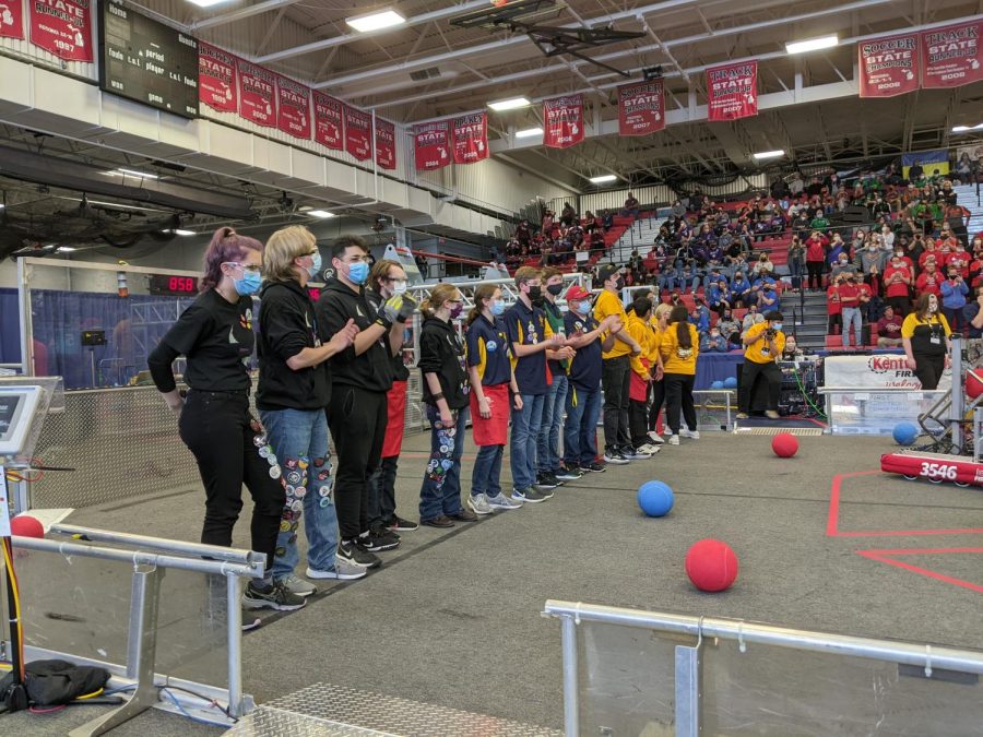 FRC team Demons Robotics 858 and their alliance partners 3546 BucNGears and 245 Adambots lined up next to each other before the 2022 East Kentwood competition finals.