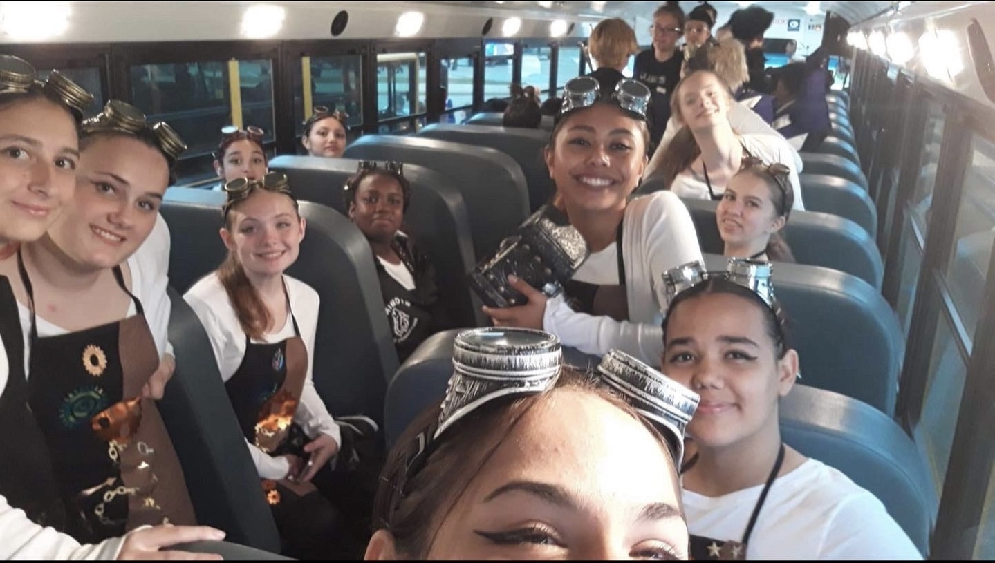 colorguard in the bus before a competition